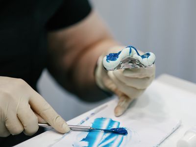 Orthodontist Working In Dental Laboratory