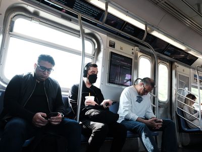 NYC subway with masked passenger COVID