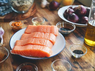 Fresh and raw salmon fish fillets on plate