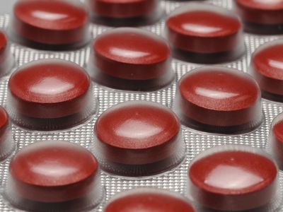 Close up of red iron tablets