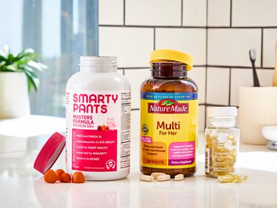 A selection some of our favorite multivitamins for women arranged on a bathroom sink