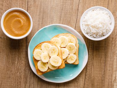 BRAT diet of bowl of rice, applesauce, and toast with bananas